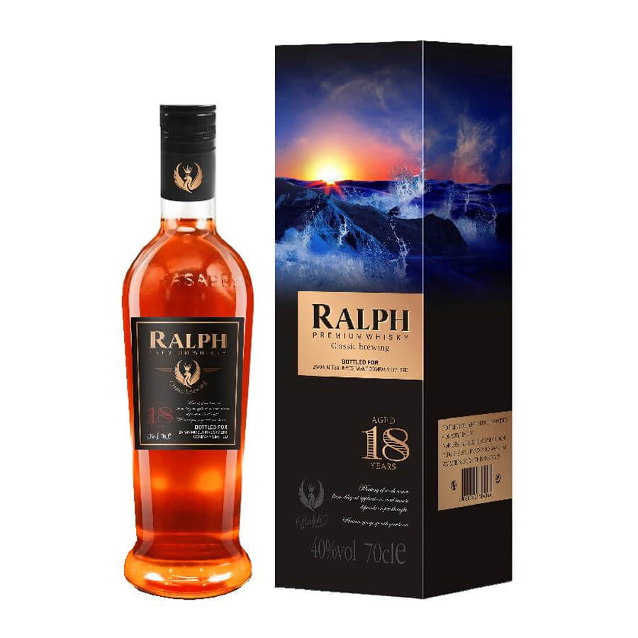 A bottle of Ralph 18 Premium Whisky with its packaging, featuring an image of a sunset over a body of water.